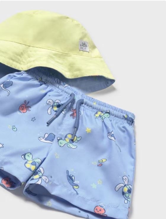 Conjunto bañador y gorro reversible protección solar bebé niño